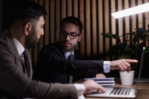 Young male in office working on desktop computer