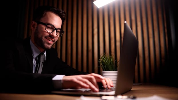 employee stretching and yawning during break in office after work done.
