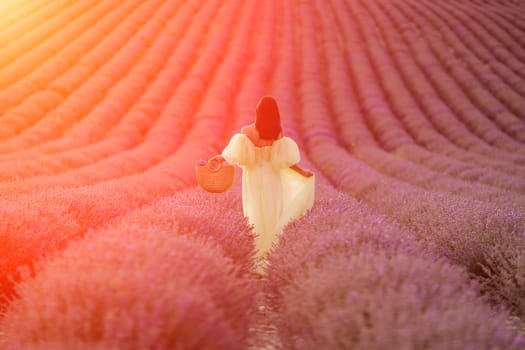 Lavender field happy woman in yellow dress in lavender field summer time at sunset.