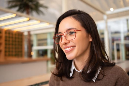 Middle age beautiful businesswoman wearing glasses close up side view portrait looking side on free space, relax profile pose with natural face and confident smile.