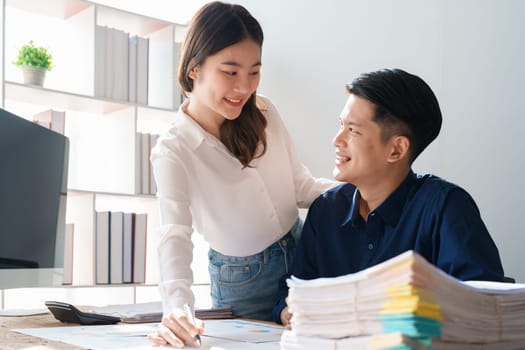 Startup family business, husband and wife discussing financial affairs, investing, making profit, tax deduction from trading using computer and investment budget paperwork working.