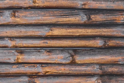 Brown painted fence boards texture wooden plank logs background.
