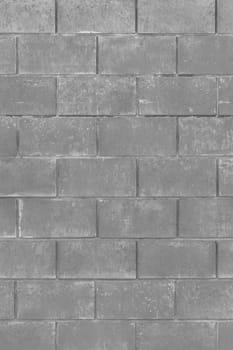 Grey paint on brick vertical blocks urban gray design wall texture background monochrome architecture.