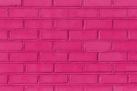 Crimson color pink paint on brick old wall texture background abstract pattern stone.