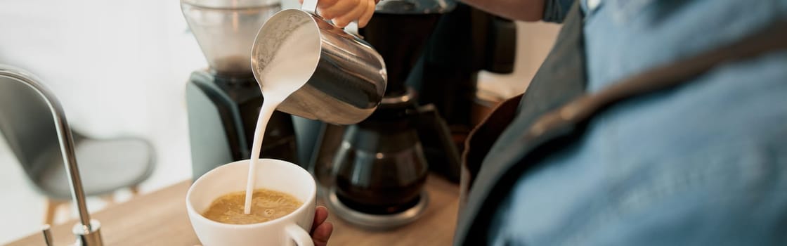 Close up of Professional barista is making fresh takeaway latte from coffee machine