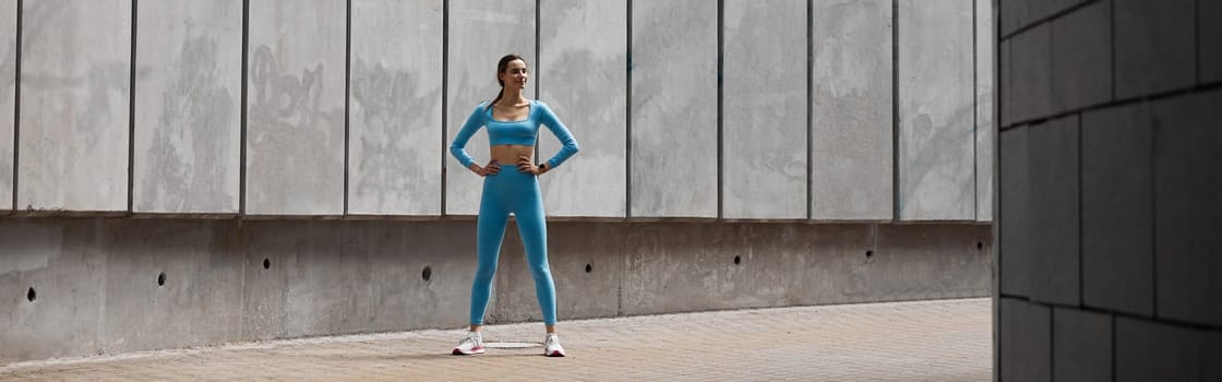 Beautiful fit young woman jogger is running outdoors