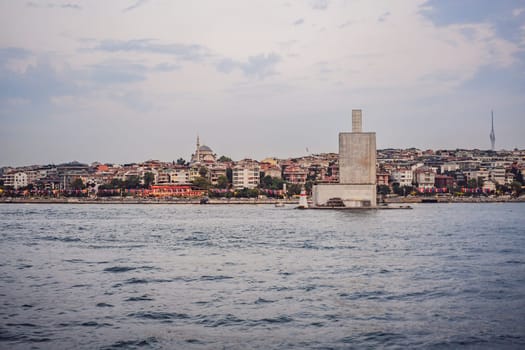 Kiz Kulesi or Maiden's Tower under reconstruction in Istanbul. Travel to Istanbul background vertical photo. landmarks of Turkey.