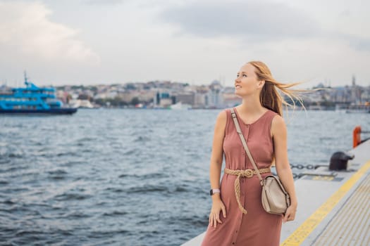 Woman tourist enjoying Galataport area view, cruise port of Istanbul newly opening in 2021, located in the shores of the Galata, Karakoy in Istanbul.