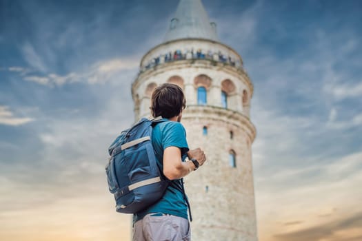 Portrait of man tourist with view of Galata tower in Beyoglu, Istanbul, Turkey. Turkiye.