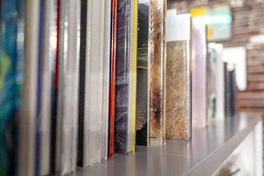 19.03.2022, Moscow, Russia. Various art books on the shelf in the store. Different editions of books are on the shelf and ready for sale