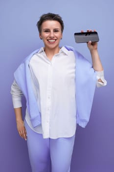 authentic young woman with short haircut showing smartphone mockup.