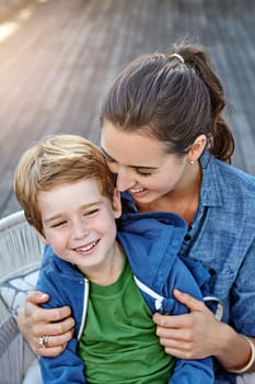 Holding on tight to love. a happy mother and her son spending time together outdoors