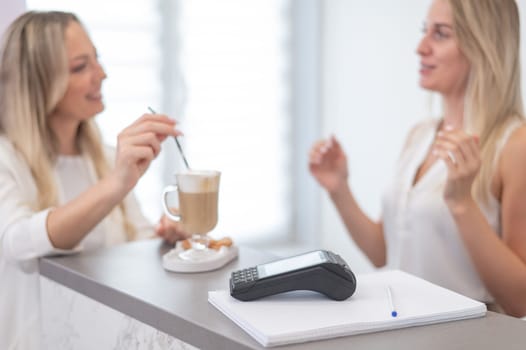 Close-up of a contactless payment terminal in a beauty salon