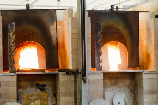 Traditional furnaces for melting glass at high temperatures.