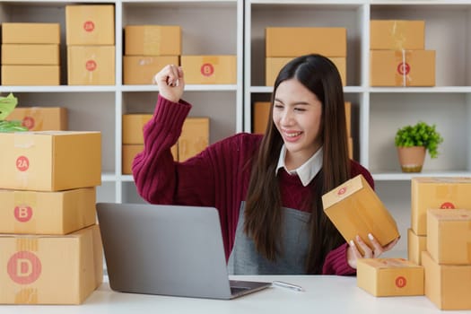 Small businesses SME owners female entrepreneurs check online orders to prepare to pack the boxes, sell to customers, sme business ideas online.