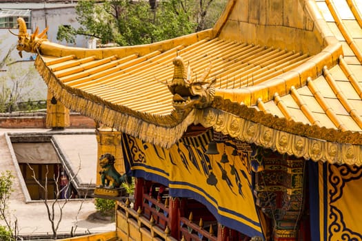 Dragons and other figures on gilded roof at stunning pagoda in Tibetan Ta'er Monastery, China