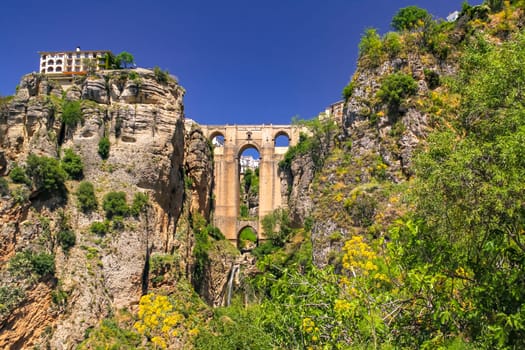 The picturesque town of Ronda with the Puente Nuevo that spectacularly bridges the gorge in the town, Andalusia, Spain