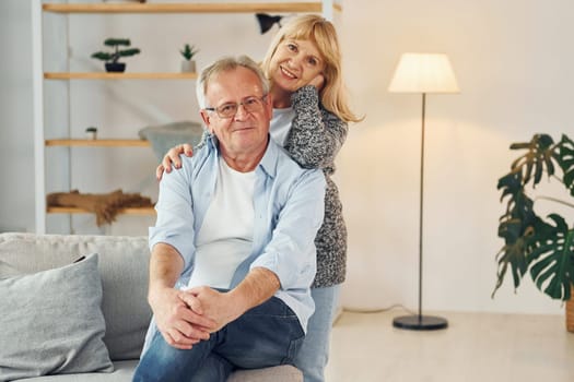 Happy together. Senior man and woman is at home.