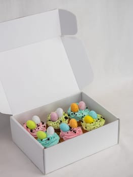 easter pastel handmade group of muffins with confetti chocolate eggs on top