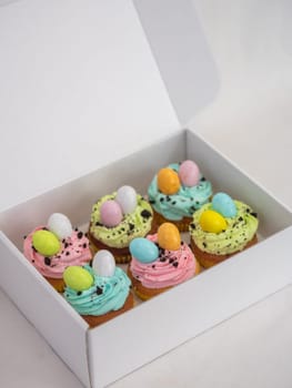 easter pastel handmade group of muffins with confetti chocolate eggs on top