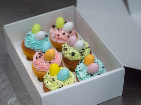easter pastel handmade group of muffins with confetti chocolate eggs on top