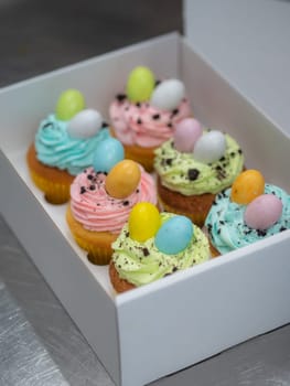easter pastel handmade group of muffins with confetti chocolate eggs on top