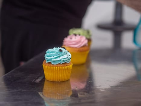 easter pastel handmade group of muffins with confetti chocolate eggs on top