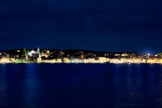 Night panorama of Rogoznica. Adriatic town of Rogoznica aerial coastline view, central Dalmatia region of Croatia.