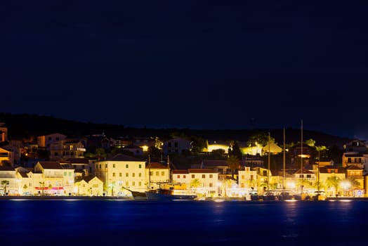 Night panorama of Rogoznica. Adriatic town of Rogoznica aerial coastline view, central Dalmatia region of Croatia.