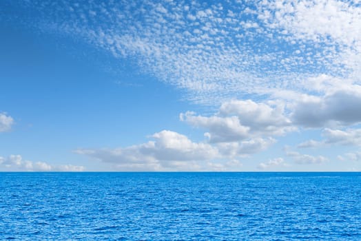 Blue sea and white clouds on sky. Water cloud horizon background. Feeling calm, cool, relaxing. The idea for cold background and copy space on the top. the ocean deep indigo