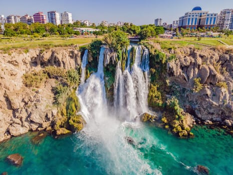 Lower Duden Falls drop off a rocky cliff falling from about 40 m into the Mediterranean Sea in amazing water clouds. Tourism and travel destination photo in Antalya, Turkey. Turkiye