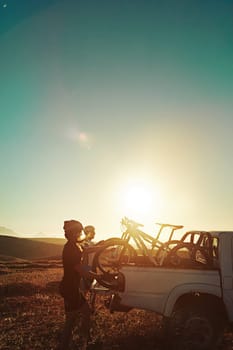 We cycle, therefore we are. a pair of adventurous mountain bikers getting ready to explore a new trail together