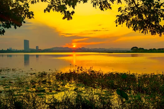 Beautiful view of Waduk Bunder or Water Dam Bunder in Gresik, East Java, Indonesia during sunrise and cloudy wheater.