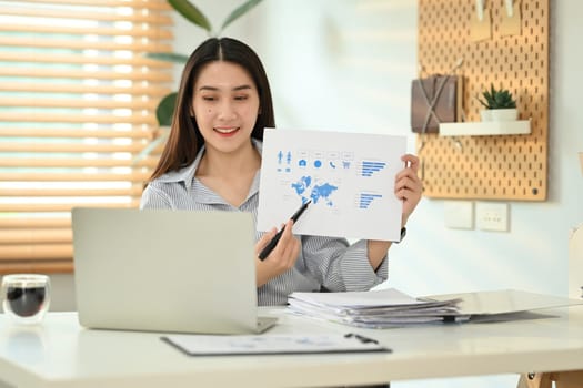 Confident female investment advisor having video call, giving online consultation to client on internet.