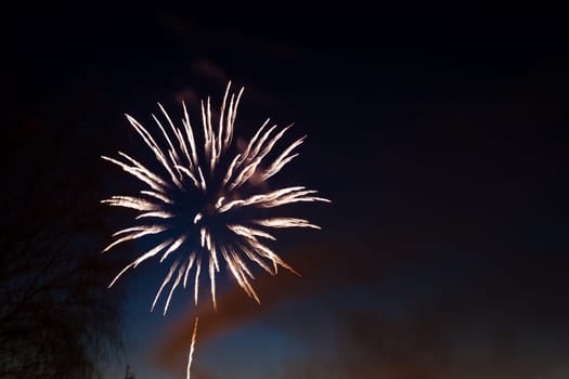 beautiful flickering flashes of fireworks in the hazy night sky close up