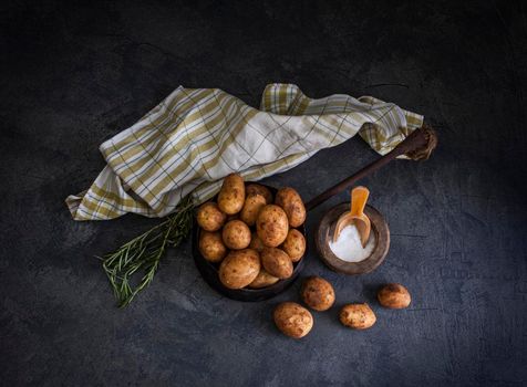 Top view of new potatoes on dark background