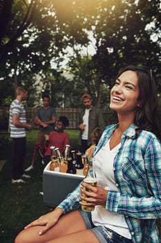 Shes really enjoying herself. a young woman enjoying a party with friends outdoors
