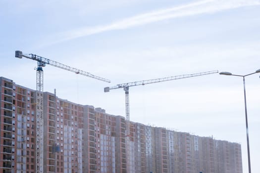 high-rise buildings under construction, development of new residential areas of the city