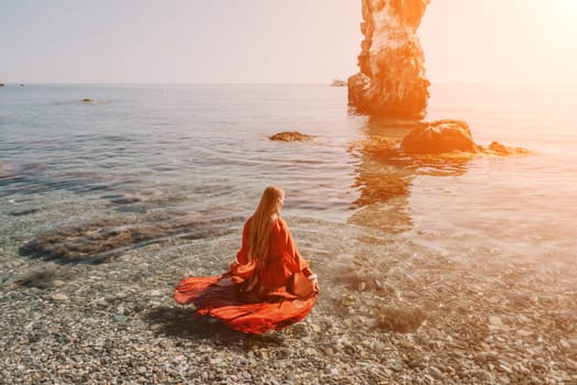 Woman travel sea. Happy tourist taking picture outdoors for memories. Woman traveler looks at the edge of the cliff on the sea bay of mountains, sharing travel adventure journey.