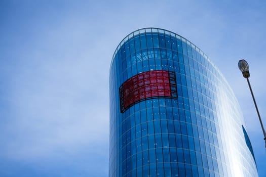 Glass facades of office buildings against a blue sky