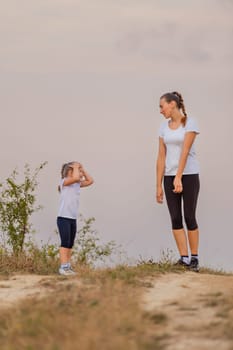 mother and daughter walking outdoors