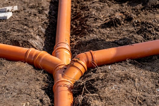 sewage system made of plastic PVC pipes in the ground.