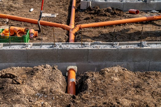 sewage system made of plastic PVC pipes in the ground.