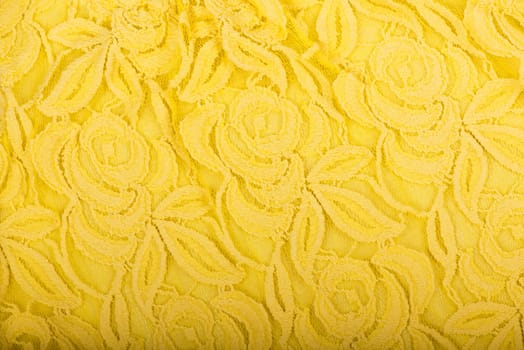 Canvas background, golden yellow fabric texture background, lace pattern detail. Golden yellow fabric texture for background, natural textile pattern. Canvas background.
