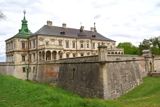 History of Ukraine. Tourism. Aerial view Tourists see old Pidhirtsi castle, near Lviv, Ukraine. May 2021