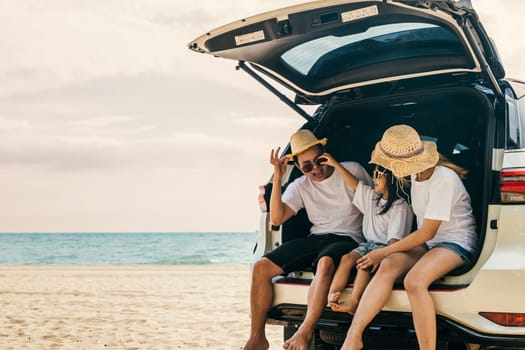 Parents and children travel in holiday at sea beach, family having fun in summer vacation on beach blue sky, People enjoying road trip sitting down on back their car, Happy Family and Road trips Day