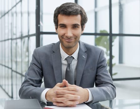 Businessman at the desk with in his office.