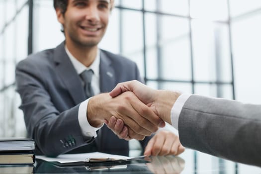 businessman extends his hand for a hand shake