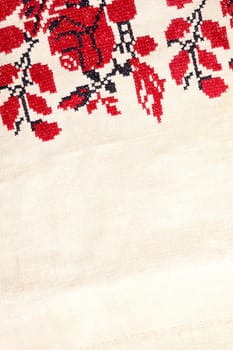 Beige white farmhouse style stripes texture. Woven linen cloth pattern background. Line striped closeup weave fabric for kitchen towel material. Pinstripe fiber picnic table cloth . Black and red embroidery. Embroidered good like old handmade cross-stitch ethnic Ukraine pattern. Ukrainian rushnyk . Red version over white background.