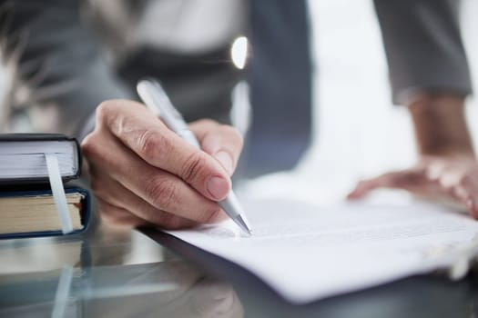 executive ceo manager writing notes in notebook at workplace.